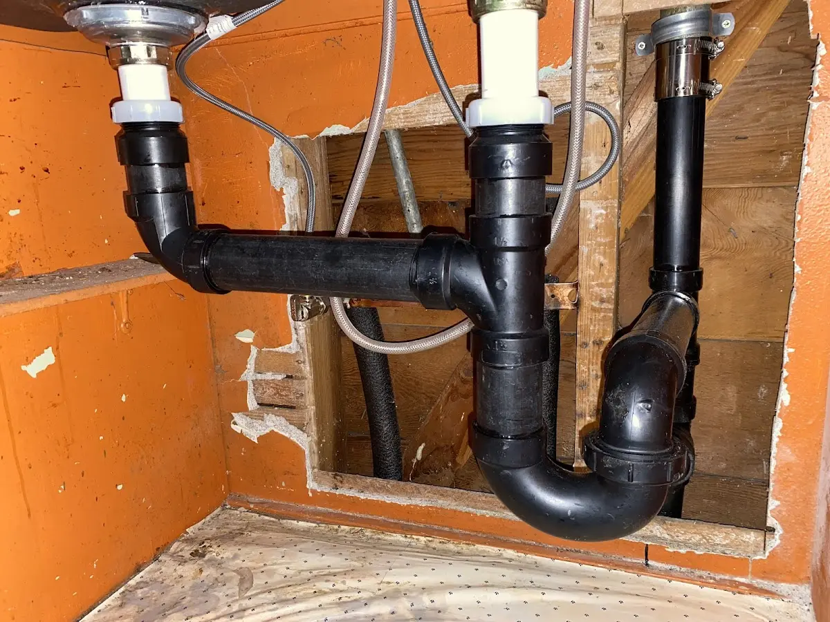 Professional Garbage Disposal Repair equipment and tools on the job in Hermantown